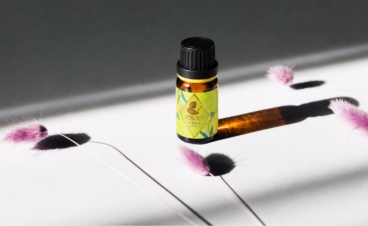 EPRHAN essential oil bottle with botanical flowers on a minimalist white background